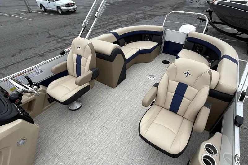 Slide: The Image of 2026 Berkshire 22RFX CTS pontoon boat interior with beige and blue seating. - 10