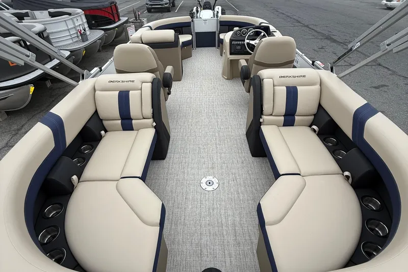 Slide: The Image of 2026 Berkshire 22RFX CTS pontoon boat interior with beige and blue seating. - 11