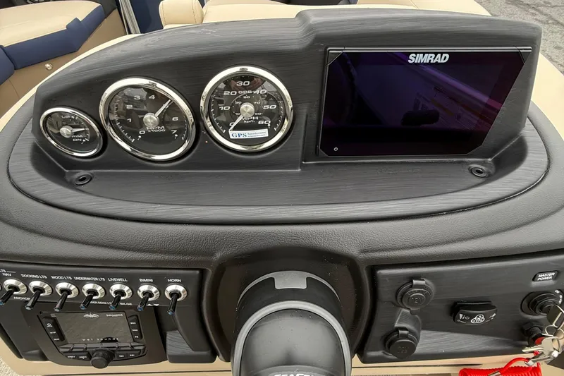 Slide: The Image of Dashboard of 2026 Berkshire 22RFX CTS boat with gauges and Simrad display. - 13