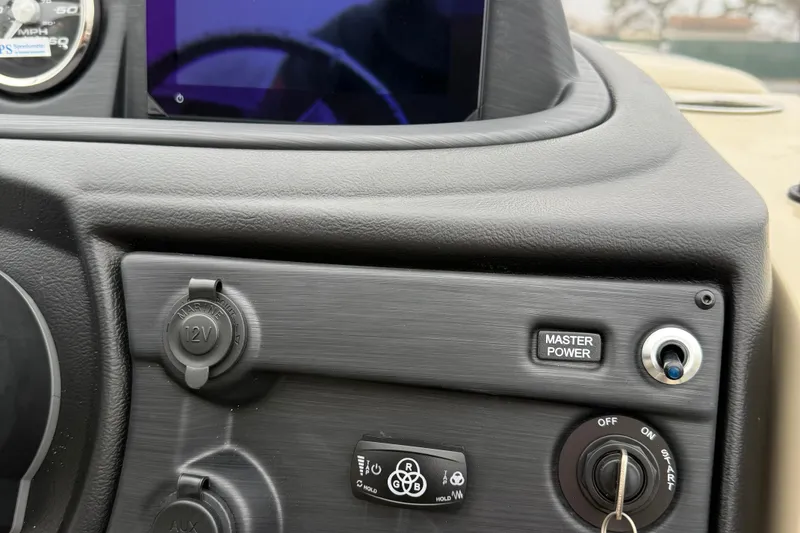 Slide: The Image of Dashboard of 2026 Berkshire 22RFX CTS with power controls and key ignition. - 15