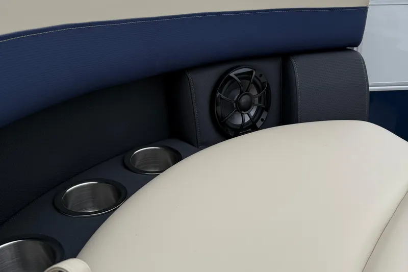 Slide: The Image of 2026 Berkshire 22RFX CTS boat interior with cup holders and speaker detail. - 17