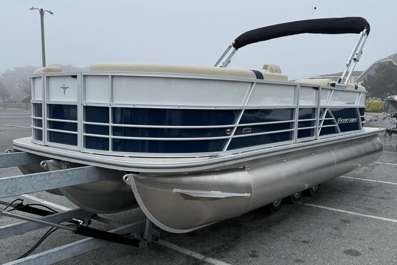 Slide: The Image of 2026 Berkshire 22RFX CTS pontoon boat on trailer in foggy parking lot. - 4