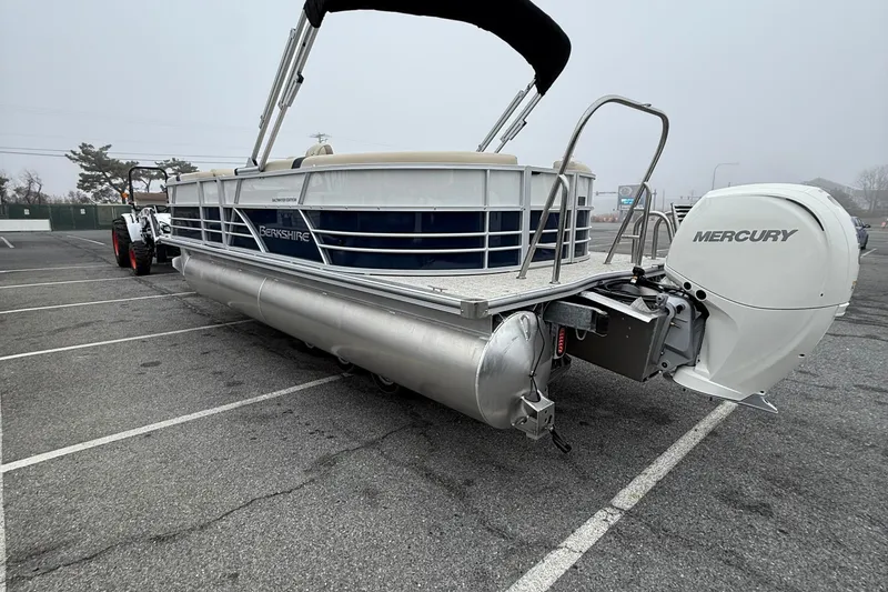 Slide: The Image of 2026 Berkshire 22RFX CTS pontoon boat with Mercury engine in parking lot. - 6