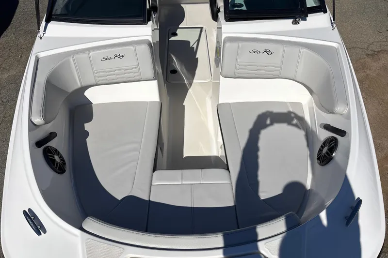 Slide: The Image of 2023 Sea Ray SPX 210 Outboard boat interior with gray seating and speaker system. - 13