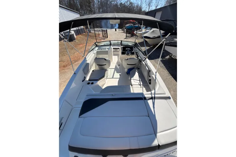 Slide: The Image of 2023 Sea Ray SPX 210 Outboard boat with spacious seating and canopy. - 23