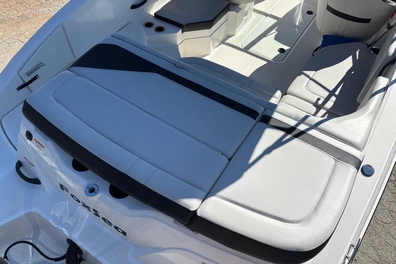 Slide: The Image of 2023 Sea Ray SPX 210 Outboard boat interior with sleek seating and modern design. - 24