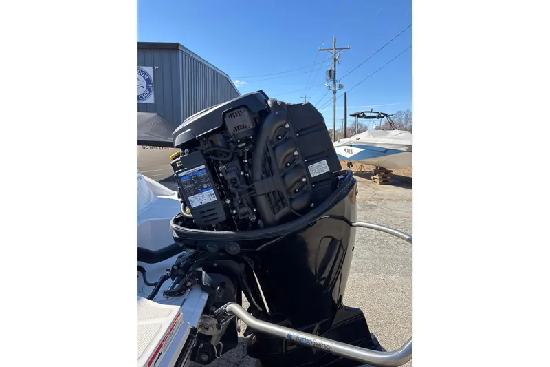 Slide: The Image of 2023 Sea Ray SPX 210 Outboard engine displayed outdoors near a boat club. - 27