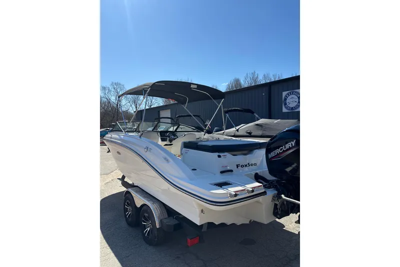 Slide: The Image of 2023 Sea Ray SPX 210 Outboard boat with Mercury engine, parked outdoors. - 5