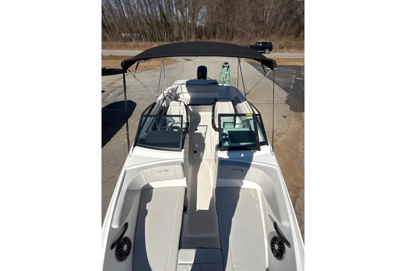 Slide: The Image of 2023 Sea Ray SPX 210 Outboard boat with spacious seating and canopy. - 8