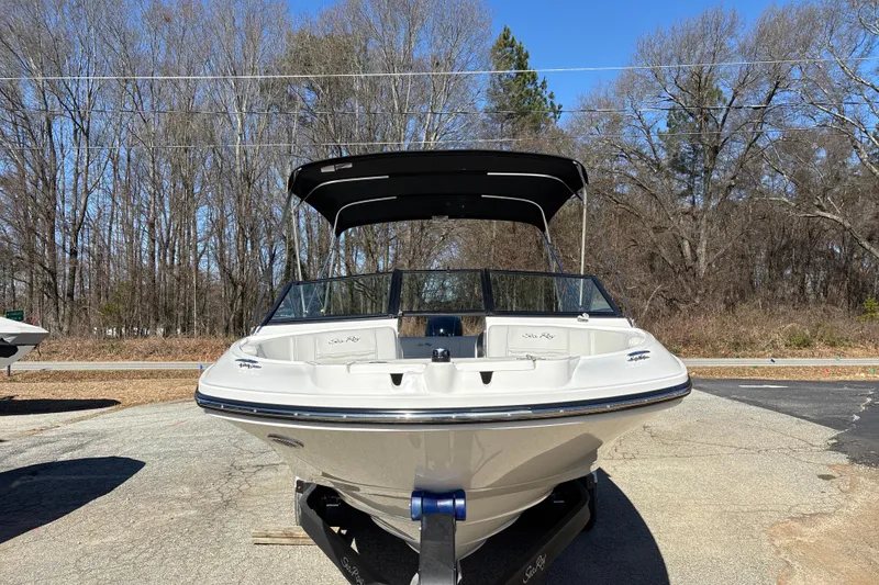 Slide: The Image of 2023 Sea Ray SPX 210 Outboard boat on trailer, parked outdoors. - 9