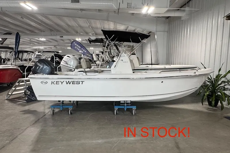 The Image of 2026 Key West 1720 Center Console boat in showroom, labeled "In Stock." - 0