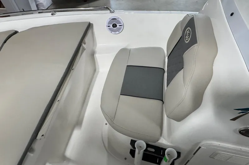 Slide: The Image of 2026 Key West 1720 Center Console boat seating area with cushioned seats and speaker. - 10