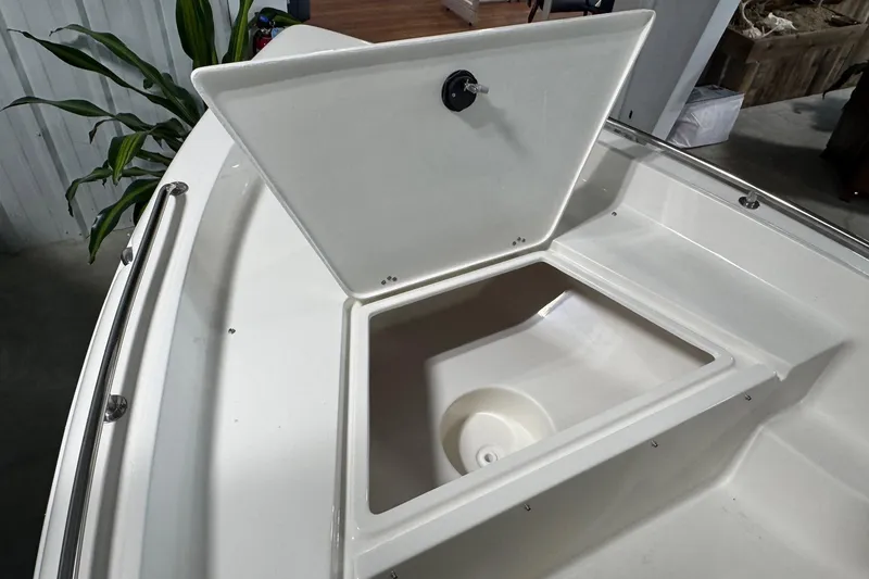 Slide: The Image of Open storage compartment on 2026 Key West 1720 Center Console boat. - 13