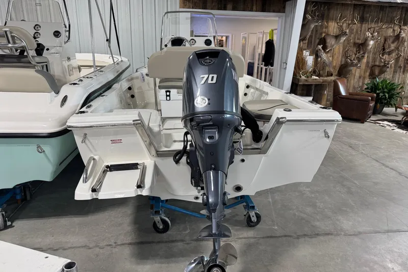 Slide: The Image of 2026 Key West 1720 Center Console boat with 70 HP outboard motor in showroom. - 16