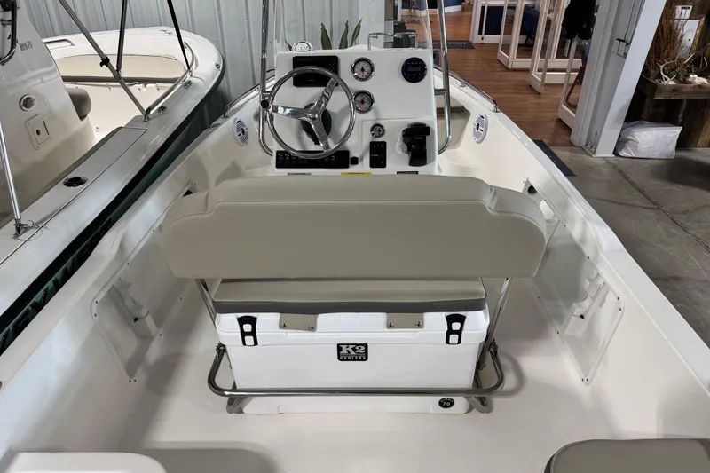 Slide: The Image of 2026 Key West 1720 Center Console boat interior with steering wheel and seating. - 4