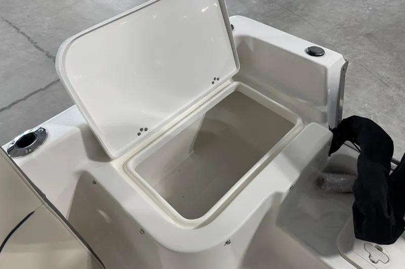 Slide: The Image of Open storage compartment on 2026 Key West 1720 Center Console boat. - 5