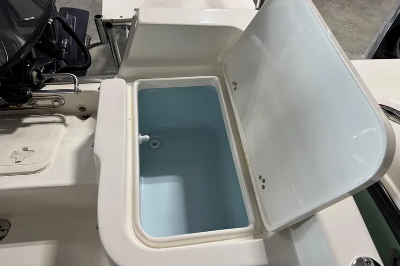 Slide: The Image of Open storage compartment on 2026 Key West 1720 Center Console boat. - 6