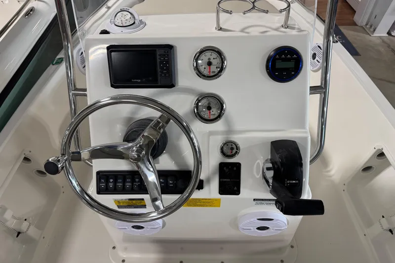 Slide: The Image of 2026 Key West 1720 Center Console boat dashboard with steering wheel and navigation instruments. - 7