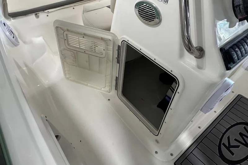 Slide: The Image of 2026 Key West 1720 Center Console boat interior with open storage compartment. - 9