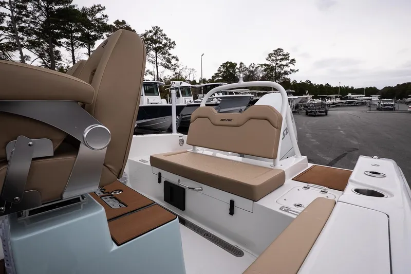Slide: The Image of 2026 Sea Pro 245FLXR Sandbar boat interior with tan seating and modern design. - 11