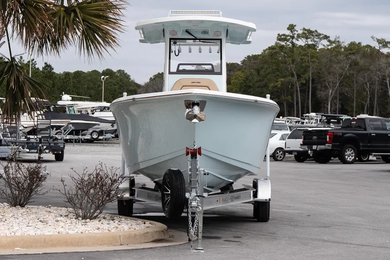 Slide: The Image of 2026 Sea Pro 245FLXR Sandbar boat on trailer in parking lot. - 2