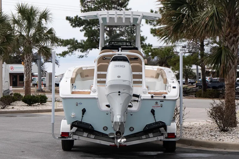Slide: The Image of 2026 Sea Pro 245FLXR Sandbar boat with powerful outboard motor, parked on trailer. - 4