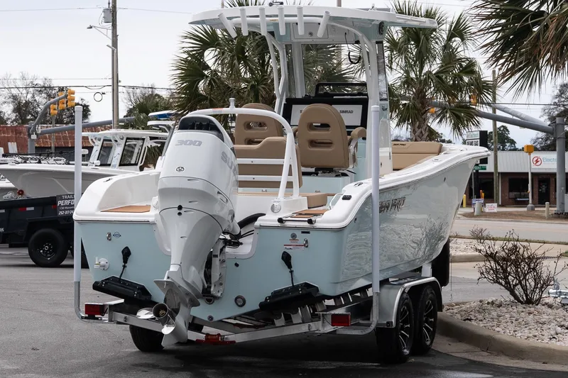 Slide: The Image of 2026 Sea Pro 245FLXR Sandbar boat on trailer, featuring a powerful outboard motor. - 5