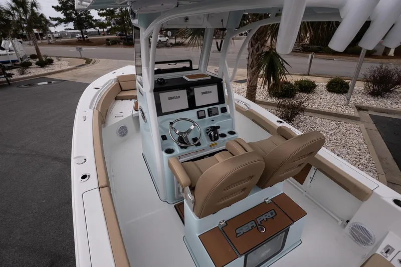 Slide: The Image of 2026 Sea Pro 245FLXR Sandbar boat interior with dual seats and modern dashboard. - 7
