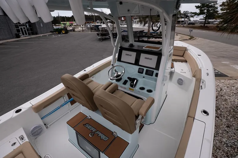 Slide: The Image of 2026 Sea Pro 245FLXR Sandbar boat interior with dual helm seats and advanced navigation systems. - 8