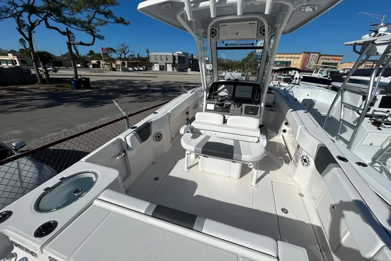 Slide: The Image of 2026 Robalo R250 Center Console boat interior with modern helm and seating. - 13