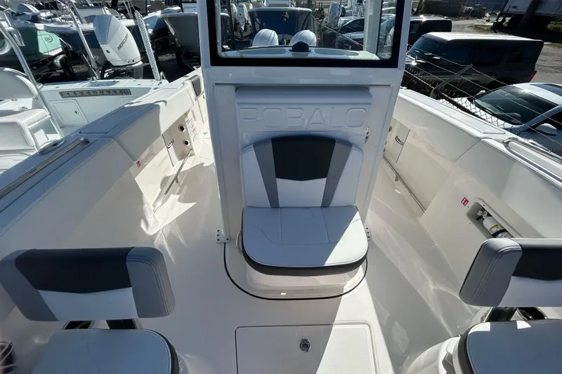 Slide: The Image of 2026 Robalo R250 Center Console boat interior with seating and storage compartments. - 18
