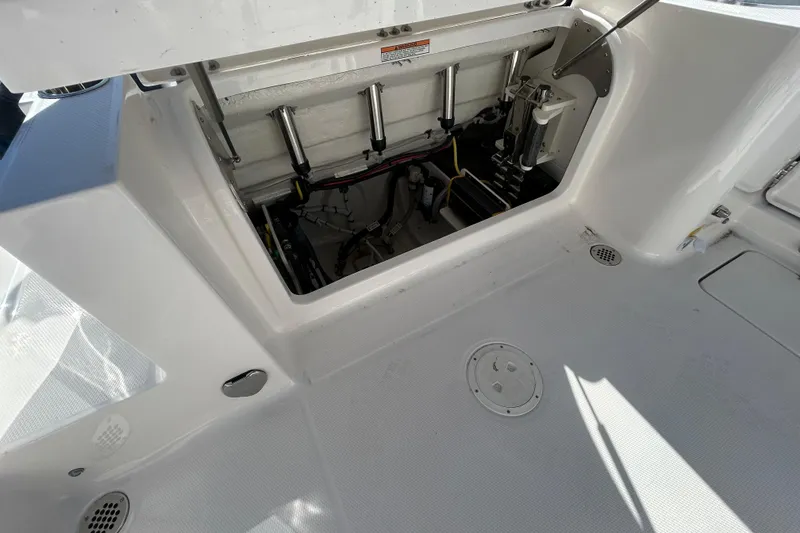 Slide: The Image of 2026 Robalo R250 Center Console boat interior with open storage compartment. - 21