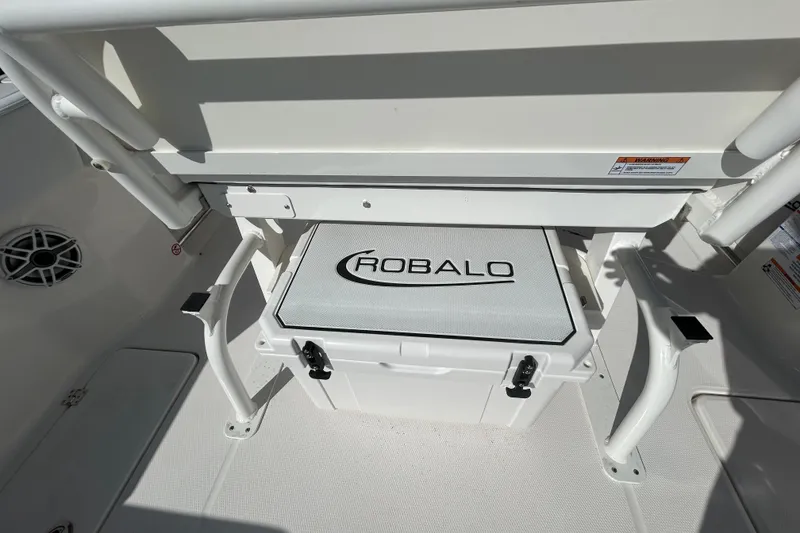 Slide: The Image of 2026 Robalo R250 Center Console boat interior with branded storage compartment. - 23