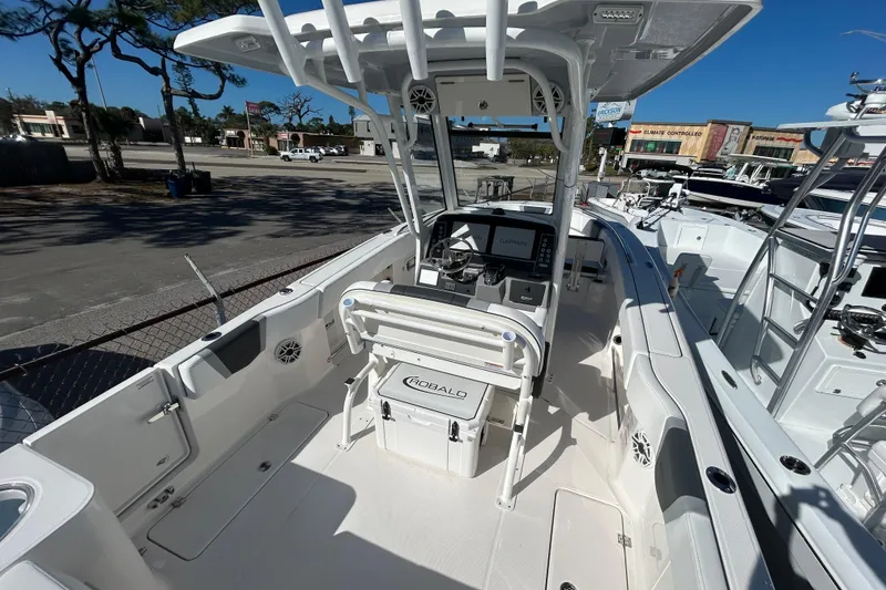 Slide: The Image of 2026 Robalo R250 Center Console boat interior with modern helm and seating. - 25