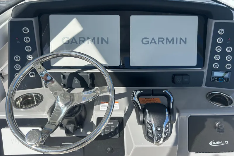 Slide: The Image of 2026 Robalo R250 Center Console dashboard with Garmin displays and steering wheel. - 26