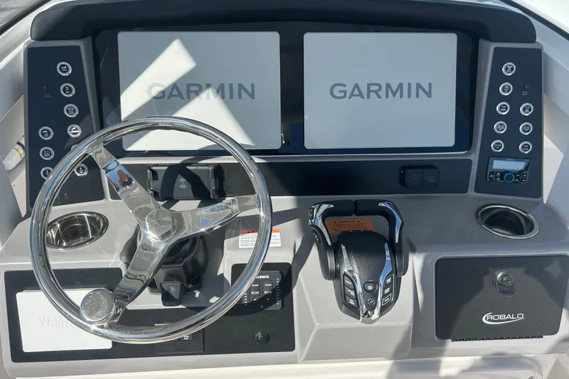 Slide: The Image of 2026 Robalo R250 Center Console dashboard with Garmin displays and steering wheel. - 27
