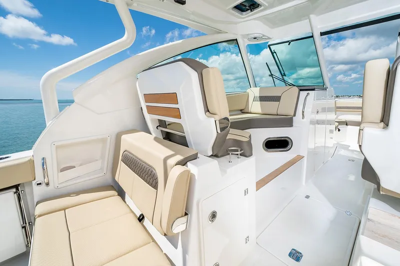 Slide: The Image of Interior of 2021 Pursuit DC 326 Dual Console with luxurious seating. - 10