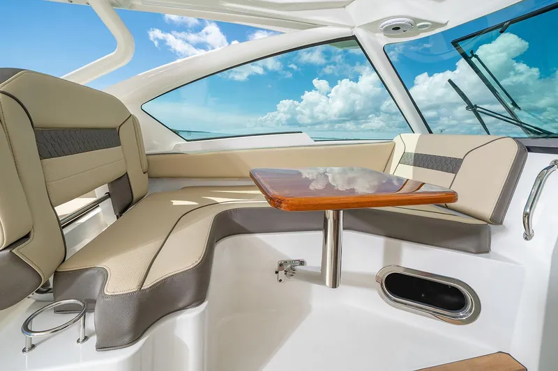 Slide: The Image of Interior of 2021 Pursuit DC 326 Dual Console with seating and table. - 12