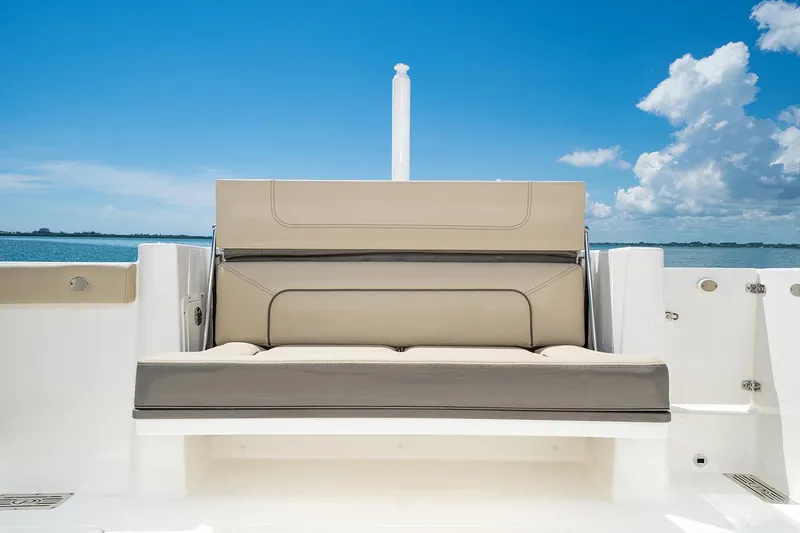 Slide: The Image of Pursuit DC 326 Dual Console 2021 with beige seating under blue sky. - 14