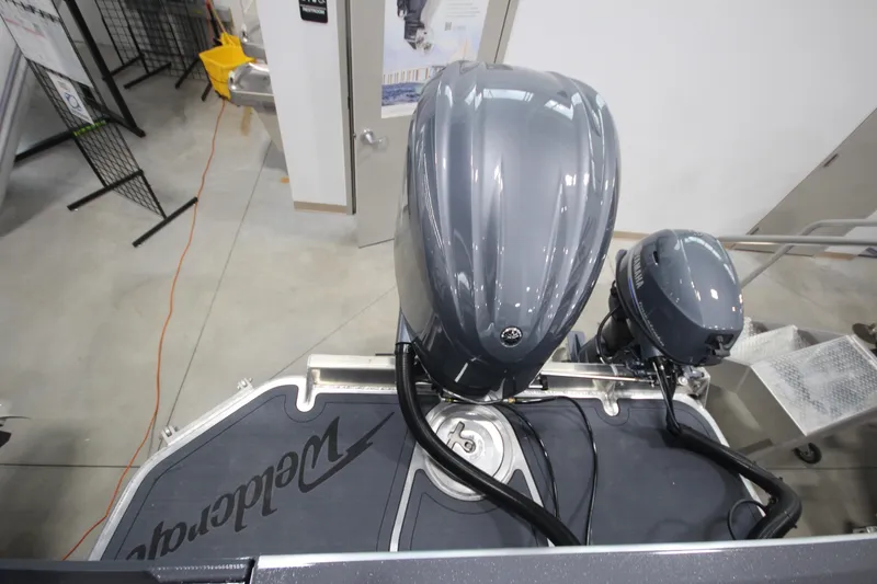 Slide: The Image of 2026 Weldcraft 240 Ocean King F300XCB boat with dual outboard motors in showroom. - 10