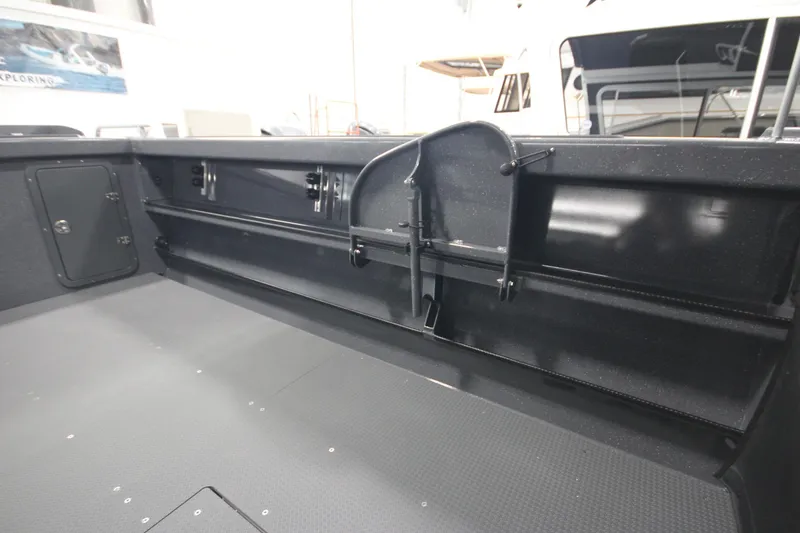 Slide: The Image of Interior view of 2026 Weldcraft 240 Ocean King F300XCB boat, showcasing storage and seating. - 16