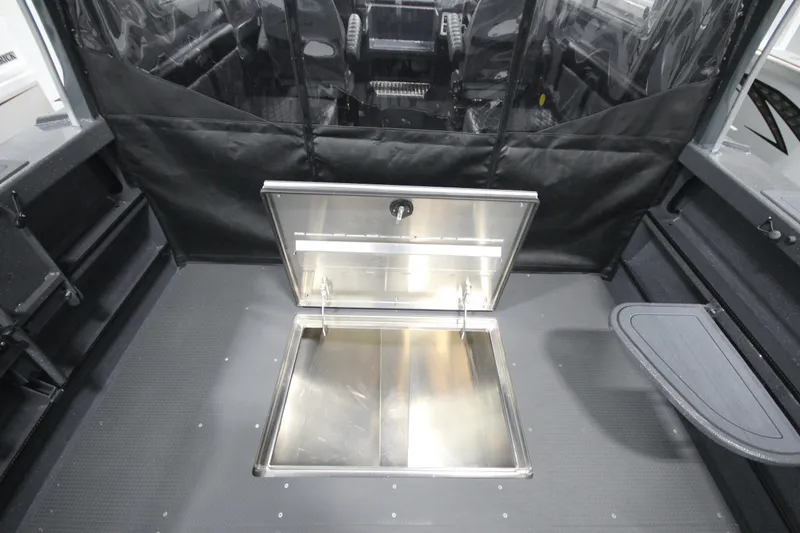 Slide: The Image of 2026 Weldcraft 240 Ocean King boat interior with open storage compartment. - 18