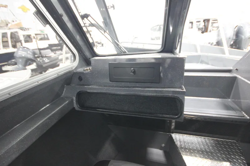 Slide: The Image of Interior view of 2026 Weldcraft 240 Ocean King F300XCB boat cockpit. - 28