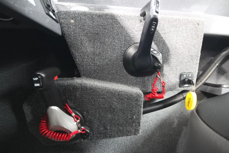 Slide: The Image of Interior controls of 2026 Weldcraft 240 Ocean King F300XCB boat, featuring throttle and switches. - 31
