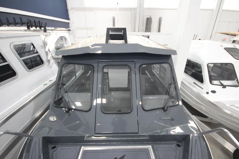 Slide: The Image of 2026 Weldcraft 240 Ocean King F300XCB boat in showroom, front view. - 37