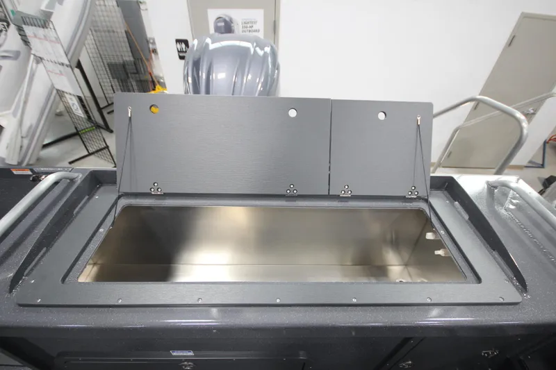 Slide: The Image of 2026 Weldcraft 240 Ocean King F300XCB boat interior with open storage compartment. - 13