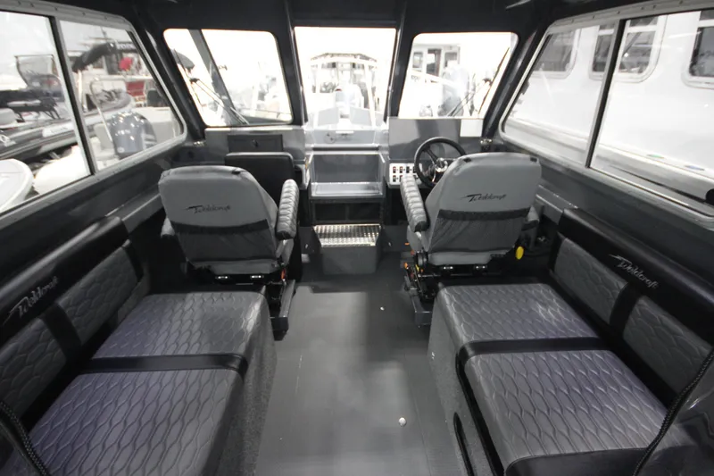 Slide: The Image of Interior of 2026 Weldcraft 240 Ocean King boat, featuring spacious seating and modern design. - 20