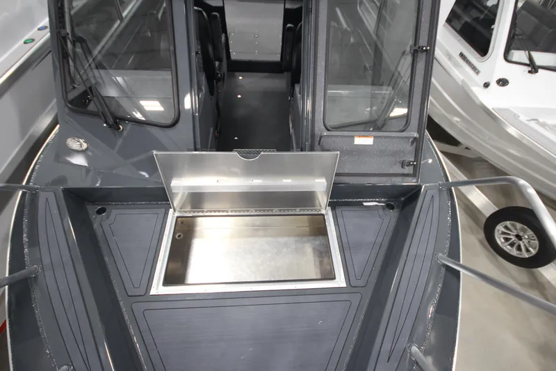 Slide: The Image of 2026 Weldcraft 240 Ocean King boat interior with open storage compartment. - 35