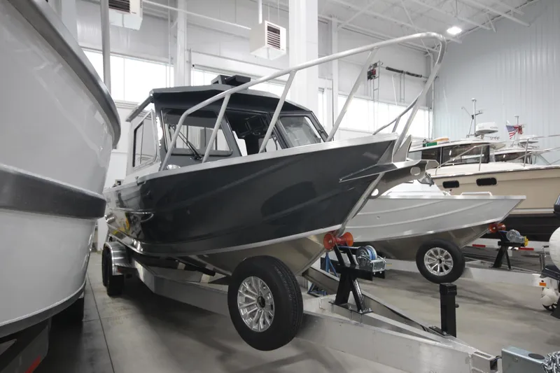 Slide: The Image of 2026 Weldcraft 240 Ocean King F300XCB boat in showroom, on trailer, ready for sale. - 4