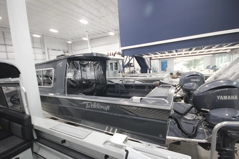 Slide: The Image of 2026 Weldcraft 240 Ocean King F300XCB boat in showroom with Yamaha engines. - 6
